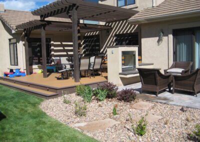 Deck featuring a Pergola and an outdoor Fireplace